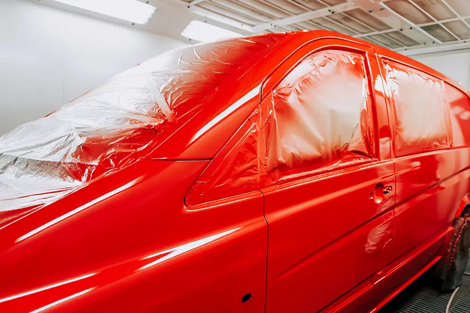 red-van-in-paintbox-paintbooth-details-of-red What to Look for in a Paint Repair Shop Near Me