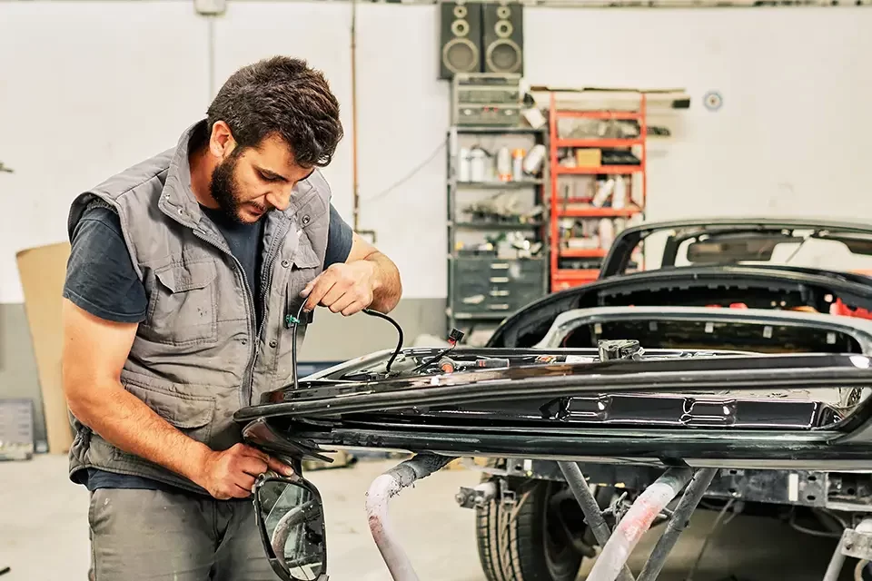 a-mechanic-working Common Signs of Car Exhaust Piping Problems