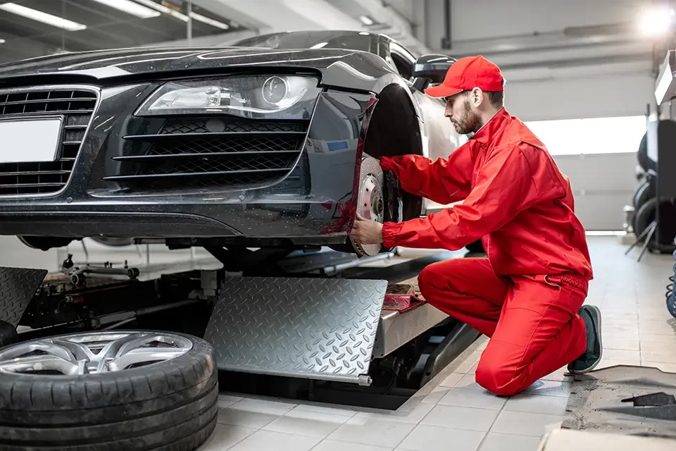 auto-mechanic-servicing-sports Understanding More About the Cause of Car Tire Wear