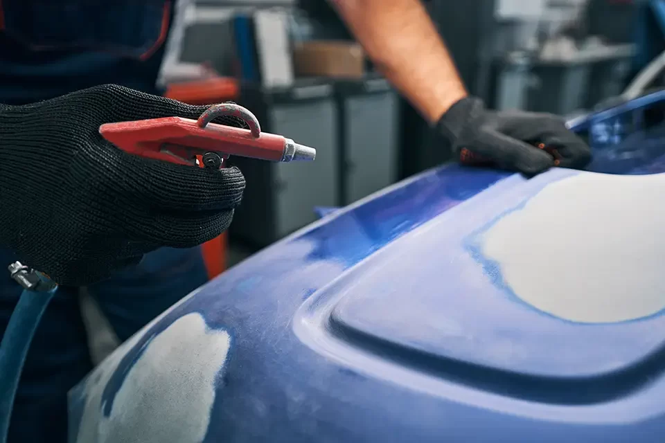 automotive-technician-pressing-on-air-gun Average Muffler Replacement Cost in Richmond Hill, Ontario