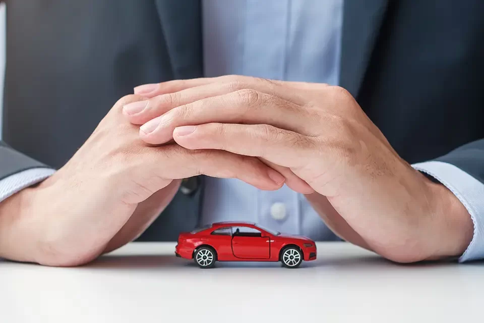 businessman-hand-cover-or-protection-red-car-toy How AutoStars Collision Mechanic Works with Co-operators Insurance