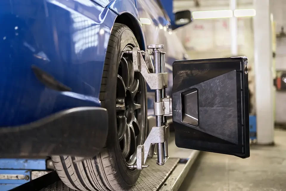car-in-service-with-sensors-on-the-wheels Signs You Need Wheel Alignment