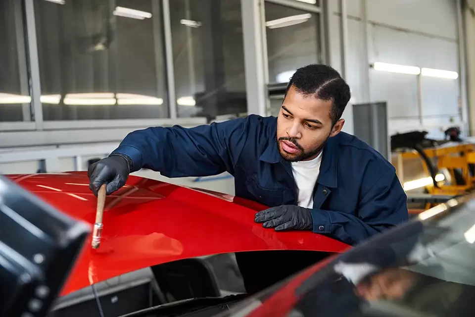 handsome-young-mechanic-skillfully-working Comprehensive Body Car Repair Services Near You