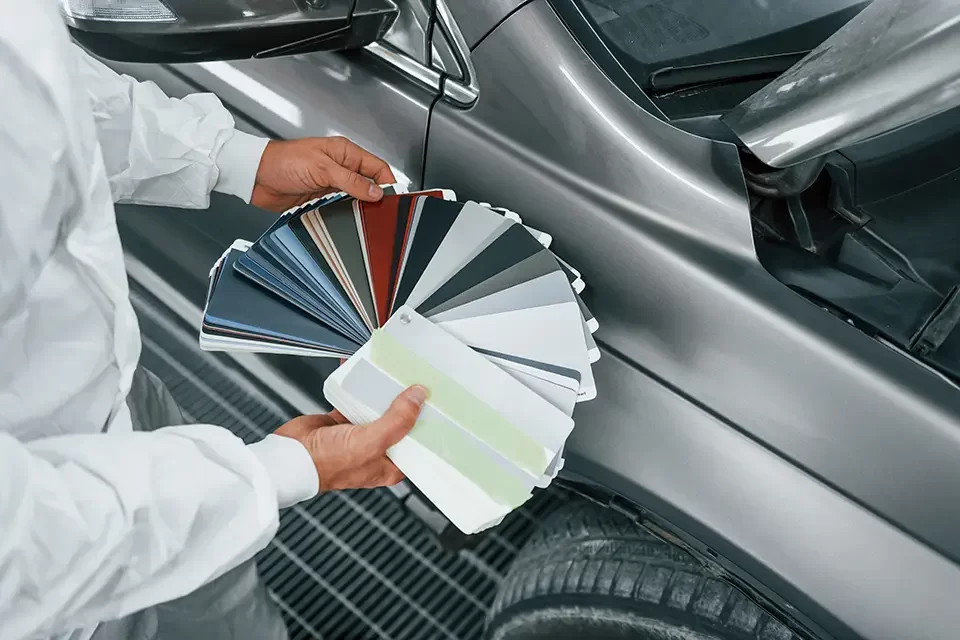 holds-cards-with-different-colors-caucasian-autom Cheap Car Paint vs. Premium Paint: What's the Difference?