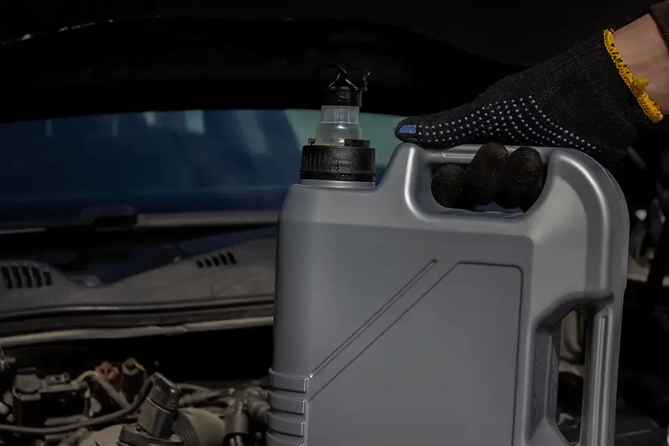refueling-and-pouring-oil-quality-into-the-engine Factors Affecting BMW Brake Fluid Change Cost